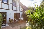 Terrasse mit Tisch und Stühlen im Garten - Christian - Top-Hundeurlaub