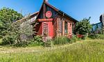 Außenansicht eines roten Ferienhauses - Alte Tischlerei 02 - Top-Hundeurlaub