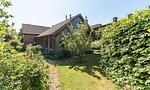 Außenansicht eines Holzhauses mit Garten - Alte Tischlerei 02 - Top-Hundeurlaub
