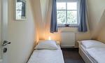 Schlafzimmer mit zwei Einzelbetten - Boddenzauber 02 - Top-Hundeurlaub