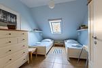 Schlafzimmer mit zwei Einzelbetten - Strandhaus Wustrow - Wohnung 3 - Top-Hundeurlaub
