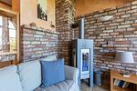 Gemütliches Wohnzimmer mit Kamin - Strandhaus Wustrow - Wohnung 5 - Top-Hundeurlaub