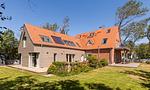 Außenansicht des Ferienhauses mit Garten - Haus Seefeuer 03 - Top-Hundeurlaub