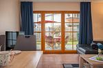 Wohnbereich mit Zugang zur Terrasse - Wohnung 1.2 - Am Schwalbenweg - Top-Hundeurlaub