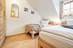 Schlafzimmer mit zwei Einzelbetten - Reihenhaus 6a - Möwe - Top-Hundeurlaub