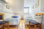 Schlafzimmer mit zwei Einzelbetten - Reihenhaus 7a - Otter - Top-Hundeurlaub