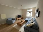 Wohnzimmer - OSTSEEKRABBE Premium Ferienwohnung familienfreundlich, zentral - Top-Hundeurlaub