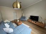 Wohnzimmer - OSTSEEKRABBE Premium Ferienwohnung familienfreundlich, zentral - Top-Hundeurlaub