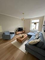 Wohnzimmer - OSTSEEKRABBE Premium Ferienwohnung familienfreundlich, zentral - Top-Hundeurlaub