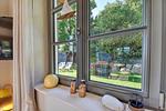 Wohnzimmer - Ferienhaus Haus Kormoran 21 Feriendorf Klein Stresow Rügen - Top-Hundeurlaub