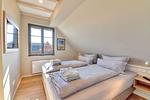 Schlafzimmer - Ferienhaus Haus Kormoran 21 Feriendorf Klein Stresow Rügen - Top-Hundeurlaub