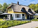 Hauptansicht - Ferienhaus Haus Kormoran 21 Feriendorf Klein Stresow Rügen - Top-Hundeurlaub