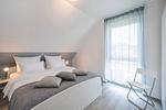 Schlafzimmer - Ferienhaus Strandmöwe OG mit Balkon sowie Garten mit Spielanlage - Top-Hundeurlaub