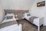 Schlafzimmer - Ferienhaus Strandmöwe OG mit Balkon sowie Garten mit Spielanlage - Top-Hundeurlaub
