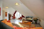 Wohnzimmer mit Blick zur Terrasse - Wohnung 63 - Top-Hundeurlaub