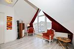 Wohnzimmer mit Sessel - Wohnung 63 - Top-Hundeurlaub