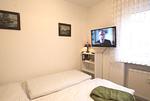 Schlafzimmer - Ferienwohnung Küstenperle - Top-Hundeurlaub