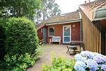 Hausansicht mit Eingangsbereich - Haus 46a Deichfalter - Top-Hundeurlaub