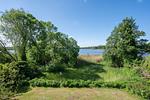 Gartenblick - Kreativhaus am See direkt am See mit Terrasse und Strandkorb - Top-Hundeurlaub