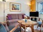 Wohnzimmer mit Blick zum TV - Haus 61c - Top-Hundeurlaub