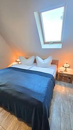 Schlafzimmer - Ferienhaus Küstenzeit – Ihr Refugium in Trassenheide - Top-Hundeurlaub