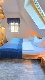 Schlafzimmer - Ferienhaus Küstenzeit – Ihr Refugium in Trassenheide - Top-Hundeurlaub
