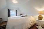 Schlafzimmer mit Meerblick und Boxspringbett (180 x 200 cm) - Strandhaus am Mühlendamm - Top-Hundeurlaub