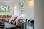 Wintergarten mit Meerblick, neben dem Wohnzimmer - Bauernhaus am Mühlendamm - Top-Hundeurlaub