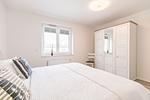Bahnhofstraße 9, Büsumer Perlenherz, Schlafzimmer 1 - Ferienwohnung Perlenherz Büsum – zentral, modern & mit Balkon - Top-Hundeurlaub