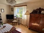 Nostalgisch eingerichtetes Wohnzimmer im Ferienhaus Hus Målen - Hus Målen - Top-Hundeurlaub