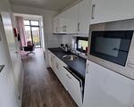 Küche / Küchenzeile - Enkhuizer Strandchalet mit Zaun Nr. 257 - Top-Hundeurlaub