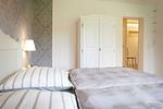 Schlafzimmer - Brise 5 am Wittensee – ebenerdige Ferienwohnung mit Terrasse & Spielscheune - Top-Hundeurlaub