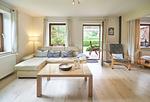 Wohnzimmer - Ferienwohnung „Waterkant“ am Wittensee – viel Platz, Garten und Spielscheune - Top-Hundeurlaub