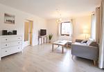 Wohnzimmer - Ferienwohnung „Waterkant“ am Wittensee – viel Platz, Garten und Spielscheune - Top-Hundeurlaub