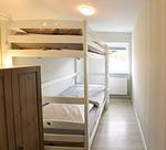 Schlafzimmer - Ferienwohnung „Waterkant“ am Wittensee – viel Platz, Garten und Spielscheune - Top-Hundeurlaub