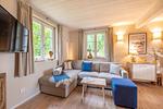Wohnzimmer - Ferienhaus Herrlichkeit 01 Feriendorf Klein Stresow Rügen - Top-Hundeurlaub