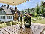Gartenblick - Ferienhaus Herrlichkeit 01 Feriendorf Klein Stresow Rügen - Top-Hundeurlaub