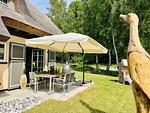 Terrasse - Ferienhaus Herrlichkeit 01 Feriendorf Klein Stresow Rügen - Top-Hundeurlaub