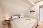 Schlafzimmer - Ferienhaus Herrlichkeit 01 Feriendorf Klein Stresow Rügen - Top-Hundeurlaub