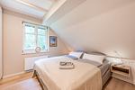 Schlafzimmer - Ferienhaus Herrlichkeit 01 Feriendorf Klein Stresow Rügen - Top-Hundeurlaub