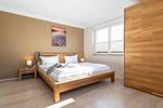 Schlafzimmer - FeWo Wellenspiel - Kamin, Sauna, Meerblick - Top-Hundeurlaub