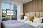 Schlafzimmer - FeWo Meerzeit - Balkon, Sauna, Meerblick - Top-Hundeurlaub
