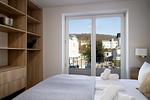 Schlafzimmer - FeWo Meerzeit - Balkon, Sauna, Meerblick - Top-Hundeurlaub