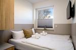 Schlafzimmer - FeWo Meerzeit - Balkon, Sauna, Meerblick - Top-Hundeurlaub