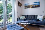 Wohnzimmer - FeWo Hafenliebe - Kamin, Sauna, Meerblick - Top-Hundeurlaub