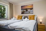 Schlafzimmer - FeWo Hafenliebe - Kamin, Sauna, Meerblick - Top-Hundeurlaub