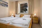 Schlafzimmer - FeWo Hafenliebe - Kamin, Sauna, Meerblick - Top-Hundeurlaub