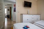 Schlafzimmer - FeWo Hafenliebe - Kamin, Sauna, Meerblick - Top-Hundeurlaub