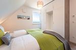 Schlafzimmer - Ferienhaus Glück unter Reet mit Sauna, Kamin und Terrasse - Top-Hundeurlaub