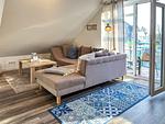 Wohnzimmer mit Blick zum Sofa - Wohnung 19 - Top-Hundeurlaub